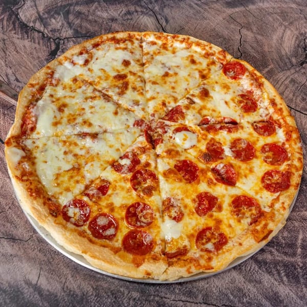 A half cheese, half pepperoni pizza from J&J PIZZA RESTAURANT on a wooden surface.